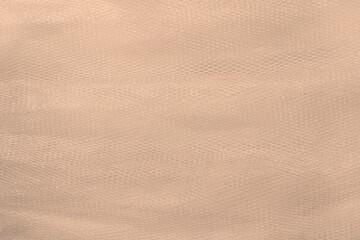 Fototapeta premium Abstract light brown background, polymer mesh texture. Wallpaper.
