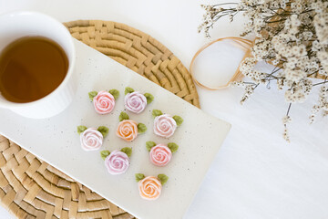 rose shape allure with hot tea, thai dessert