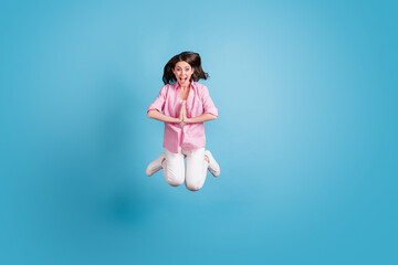 Full size portrait of crazy excited carefree lady jump palms plead request open mouth isolated on...