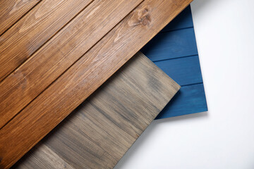 Different wooden surfaces for photography on white background, top view