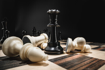 Chess board with figures on dark background