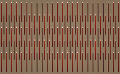 Pattern of brown pencils at grey background