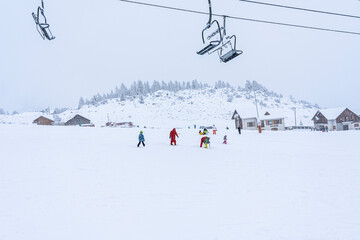 Auron, FRANCE - 01.01.2021: Empty ski slopes and ski lifts in ski resort. During the winter holidays 2021 January lifts are closed for skiing for adults due to the coronavirus pandemic.