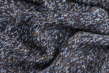 melange cozy knitwear close-up. Hand-knitted warm woolen blanket drapery. Handicraft concept