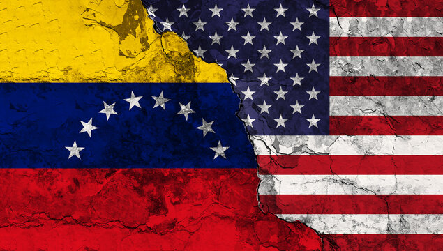 Concept of a Conflict between the United States of America and Venezuela with painted flags on a wall with a crack