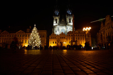 Fototapeta premium Prague, Czech Republic - January 1 2021: Nearly empty Old Town Square with Christmas decorations. Few tourists are visiting this place due to Covid-19 restrictions 