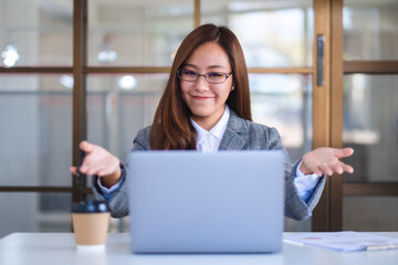 Closeup image of a beautiful businesswoman using laptop computer for working online and video conference