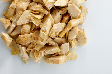 close up of a pile of roasted chicken in pieces