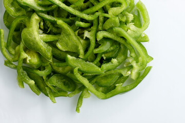 Fresh green pepper in pieces