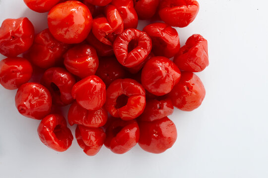 red peppadrew peppers on a white background