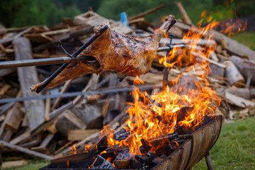 Traditional cooking mutton on fire at the festival