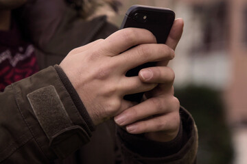 hands using on smartphone on the street
