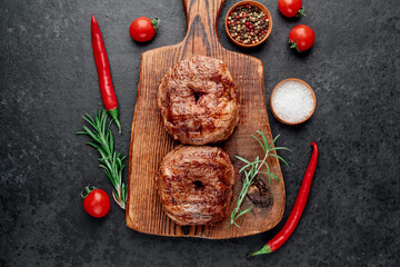 grilled beef steaks in 8 shape on stone background with copy space for your text. 8 march celebration concept	