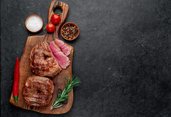 grilled beef steaks in 8 shape on stone background with copy space for your text. 8 march celebration concept	