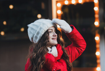 long-haired girl in a warm red jacket