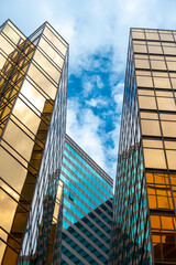 HONG KONG, CHINA - January, 2021 : Golden tall buildings and glass reflections in Hong Kong Island...