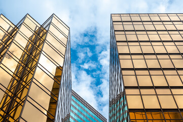 HONG KONG, CHINA - January, 2021 : Golden tall buildings and glass reflections in Hong Kong Island...