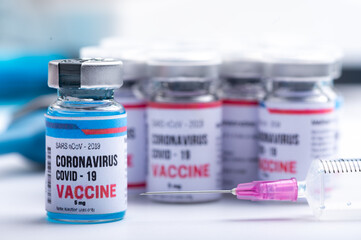 virus vaccine development of a coronavirus COVID-19, vaccine bottle in concept of insurance and fight against coronavirus 2019 ncov cure, medical research in laboratory to stop the spread of the virus