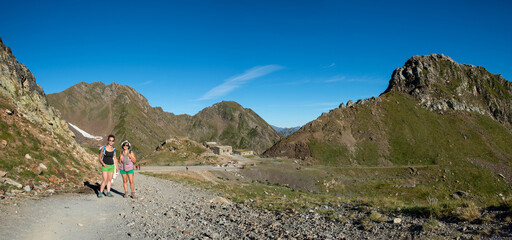 two hikers women on the path in french Pyreneees mountains