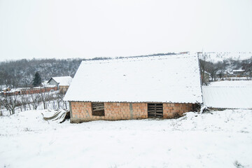 Rural winter landscape of snowy day, village in the Serbia