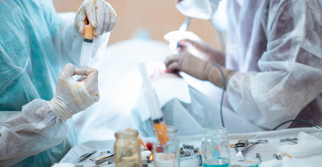 liposuction and lipofilling concept, surgery in the operating room - fat cell transplant.
