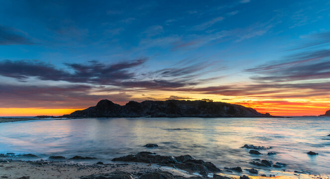 Colourful High Cloud Sunrise Seascape Panorama and Rock Formations