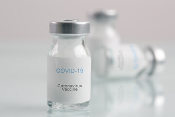 Corona Virus vaccine bottles. Vaccination, immunization, treatment to cure Covid 19 infection. Healthcare And Medical concept.