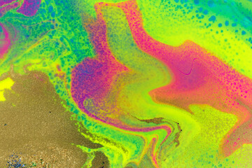 Neon colored marble pattern with golden glitter. Fluorescent liquid background. Artwork abstract bright texture with sell.