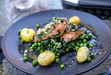 Salmon fillet with green peas and spinach