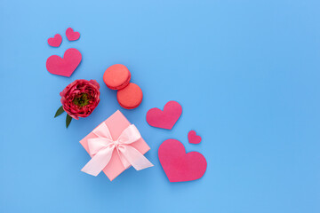 Valentines day composition: pink gift boxes with ribbon, heart and rose
