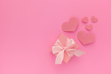 Valentines day composition: one pink gift boxes with ribbon