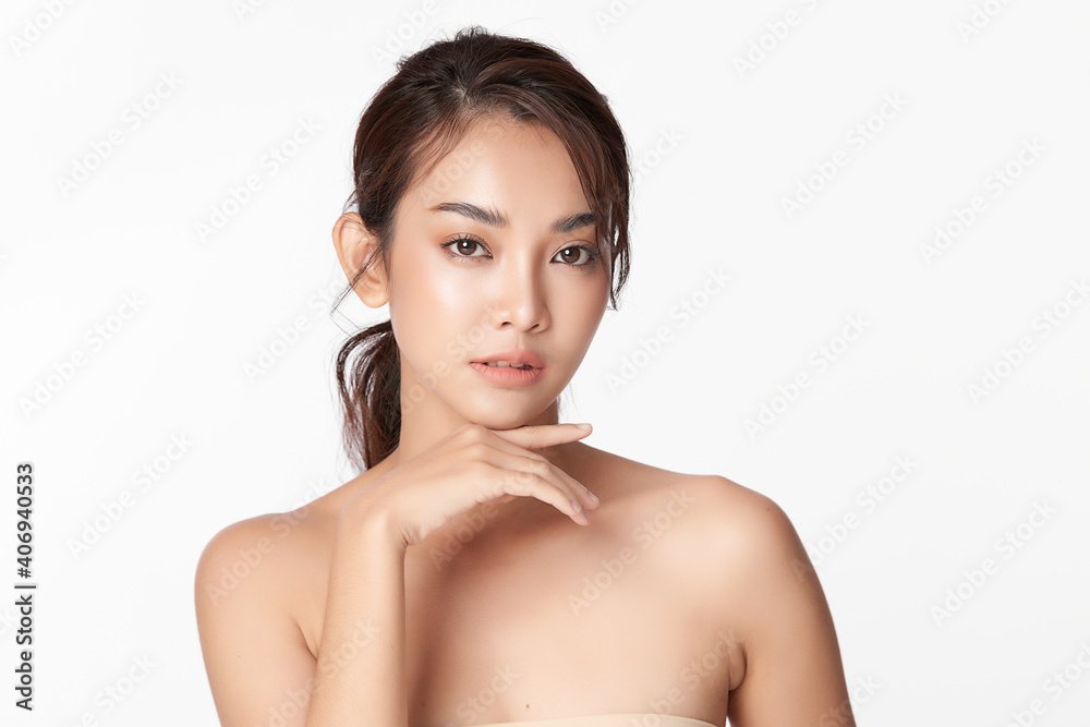 Wall mural beautiful young asian woman with clean fresh skin on white background, face care, facial treatment, 