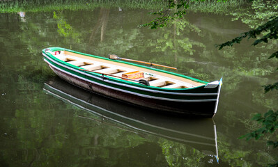 Naklejka na ściany i meble Boat on the river