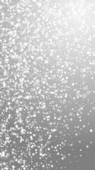 Magic stars Christmas background. Subtle flying snow flakes and stars on grey background. Amusing winter silver snowflake overlay template. Interesting vertical illustration.