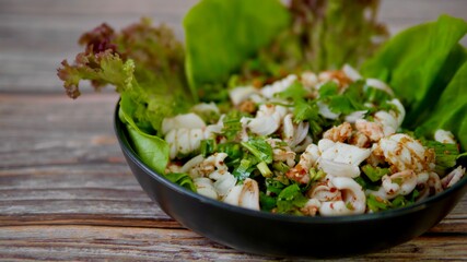 Spicy Squid Salad with vegetables appetizer dish Thai Food 