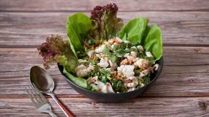 Spicy Squid Salad with vegetables appetizer dish Thai Food 