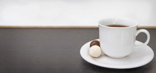 cup of coffee on wooden table