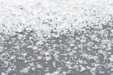 Wonderful white winter background with close up snowflakes and crystals 