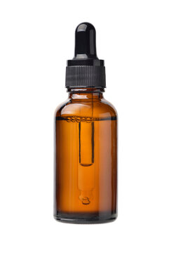 Essential serum oil in amber dropper bottle isolate on white background. Clipping path.