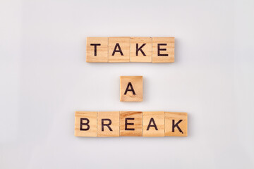 Take a break text on cubes on white background. Time to relax and stop the work.