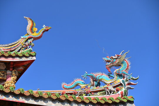 Longshan Temple, Taipei, Taiwan - January 15, 2021: Dragon-shaped Cochin pottery on the eaves of Longshan Temple.
