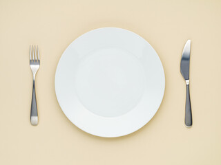 white plate on beige background