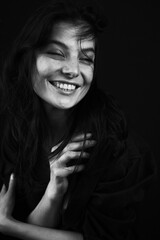 Emotional Sensual black and white portrait of a beautiful girl on a dark background