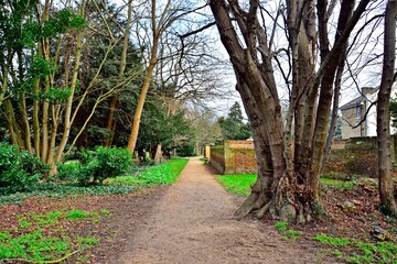 Footpath in park with wall