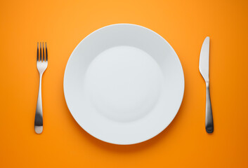 plate on orange yellow background
