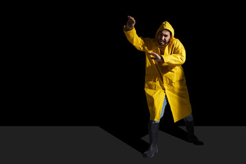 Unhappy man in raincoat grimacing and gesturing on camera
