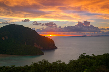 Landscape with beautiful sunset and fiery clouds in the Adaman Sea on Phi Phi Island. Thailand