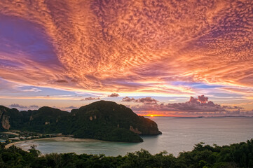 Landscape with beautiful sunset and fiery clouds in the Adaman Sea on Phi Phi Island. Thailand