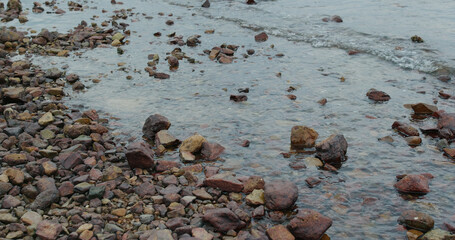 Sea waves breaking on rock