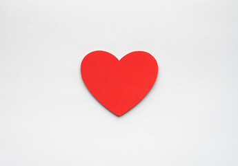 Red paper heart on white background
